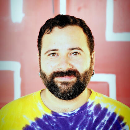 Headshot with tie-dye shirt